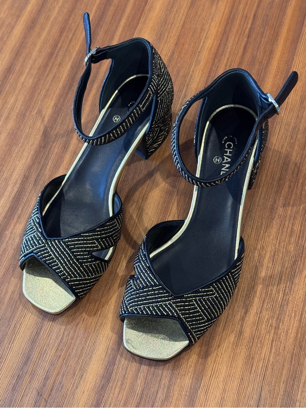 CHANEL Black Heeled Sandals with Gold Accents - Collection 23A
